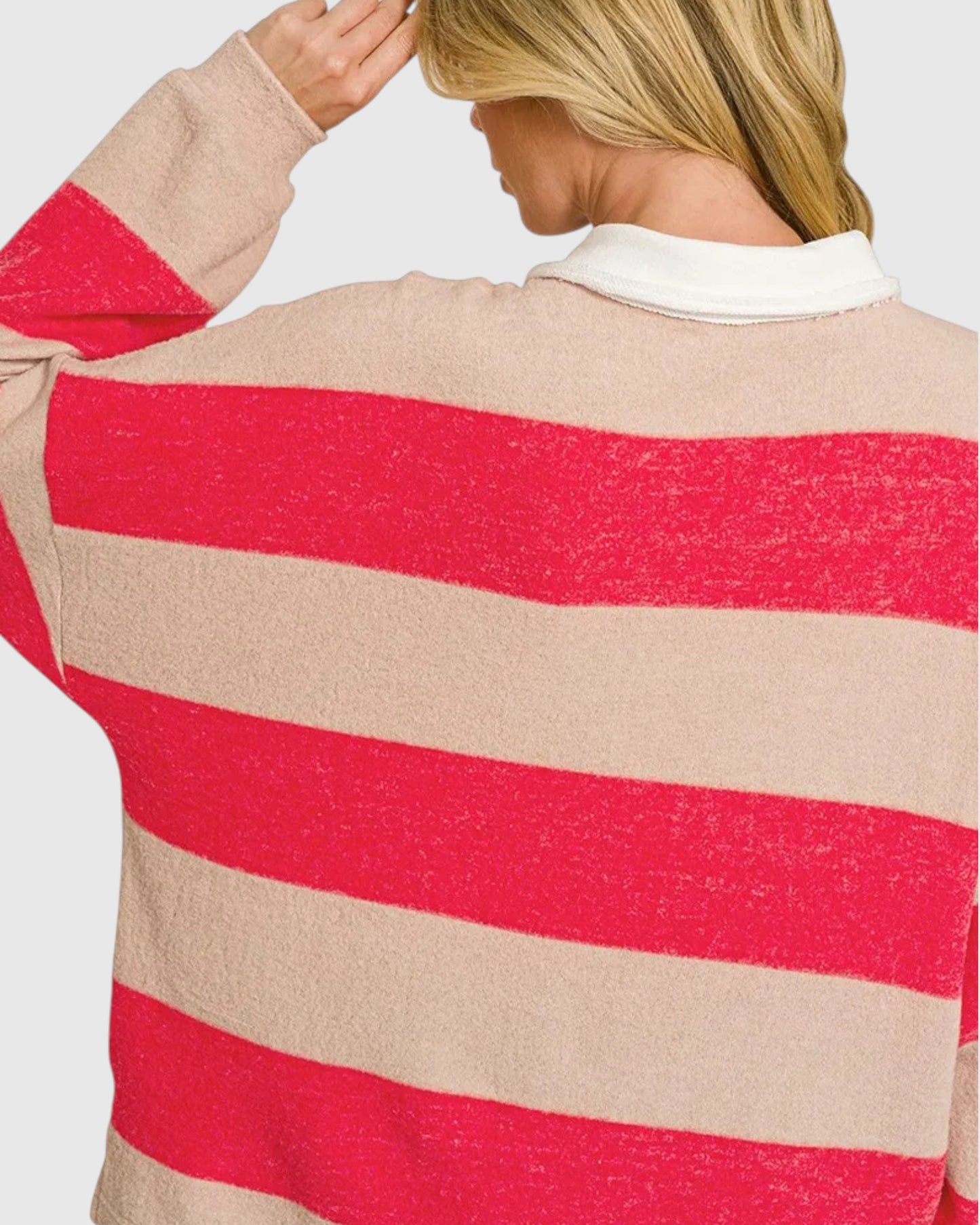 Back view of a woman wearing a red and beige striped shirt with ivory color. 