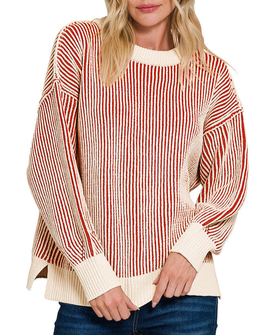 Woman wearing a red and ivory striped sweater with a white collar.