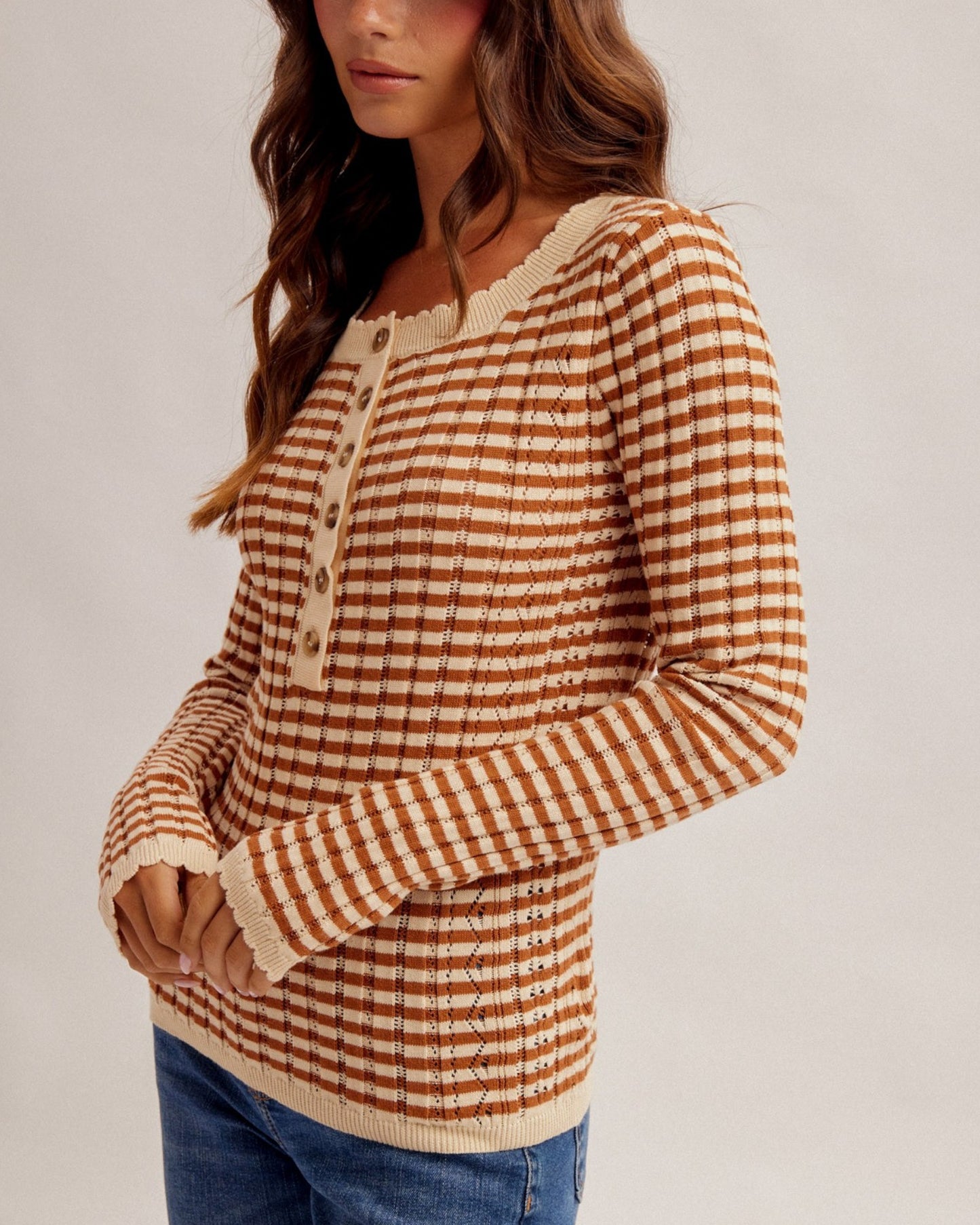 Spiced rust and cream pointelle cotton Henley top with long sleeves and contrast trim
