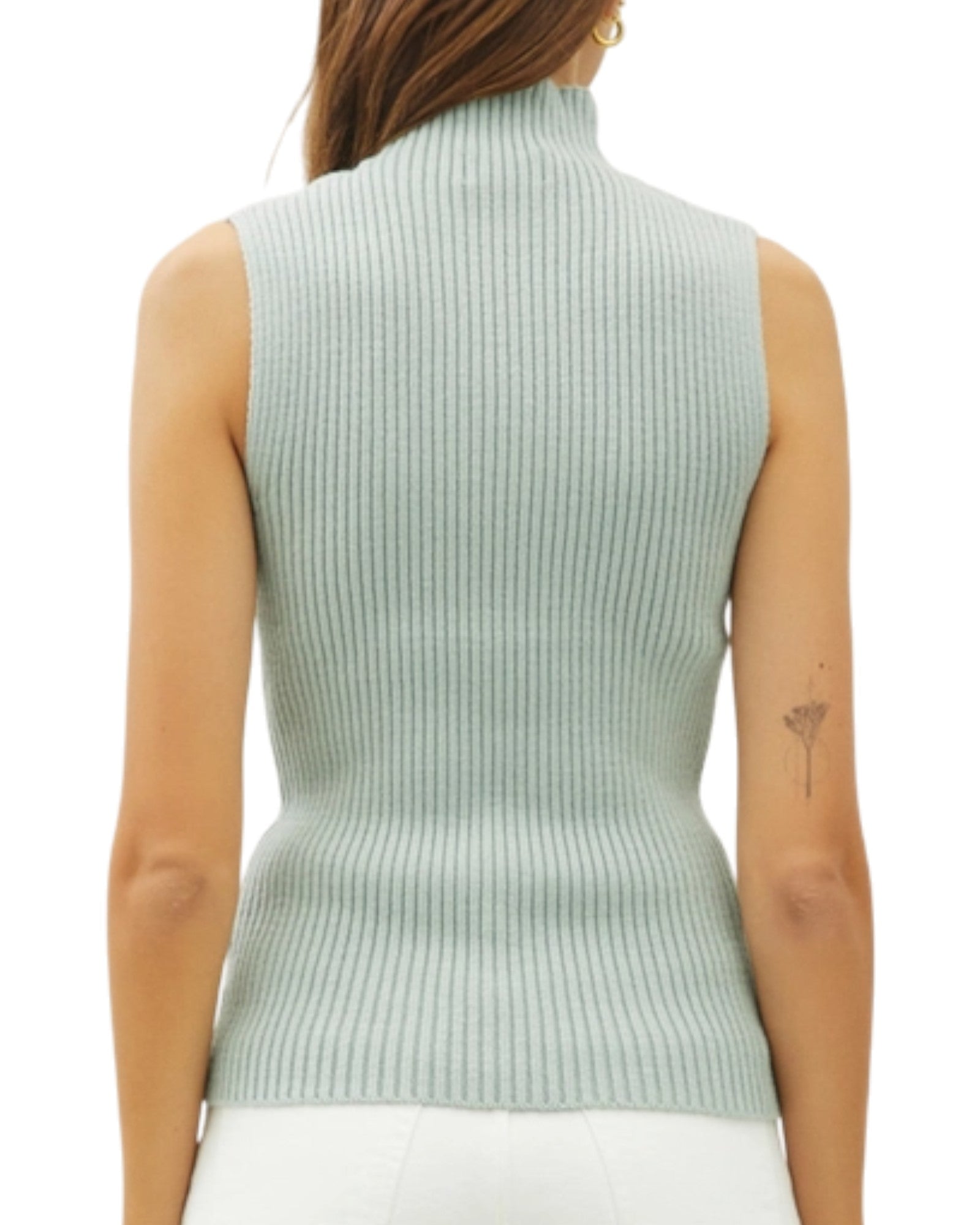 Seafoam ribbed sleeveless sweater worn by a model on a white background.