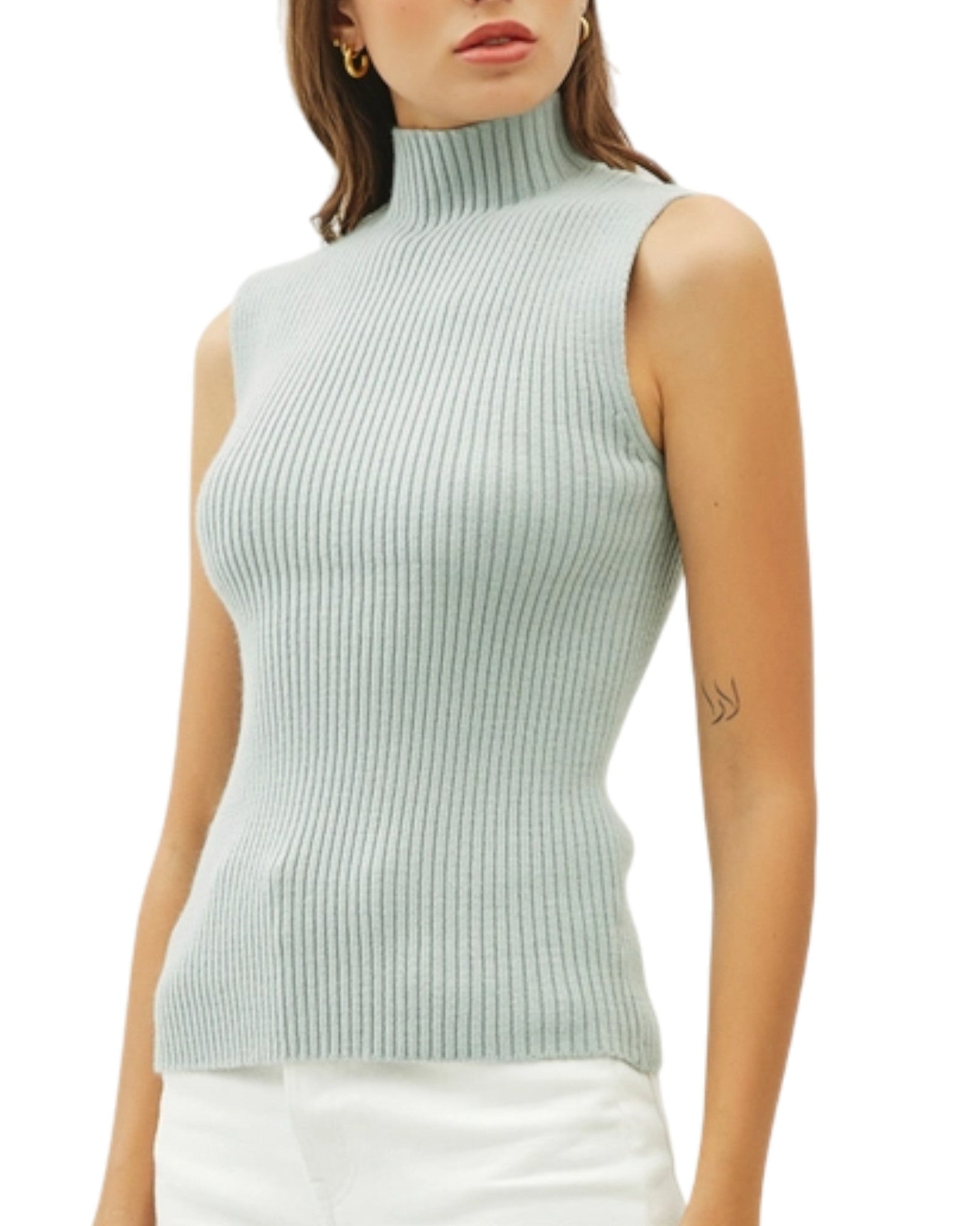 Seafoam ribbed sleeveless sweater worn by a model on a white background.