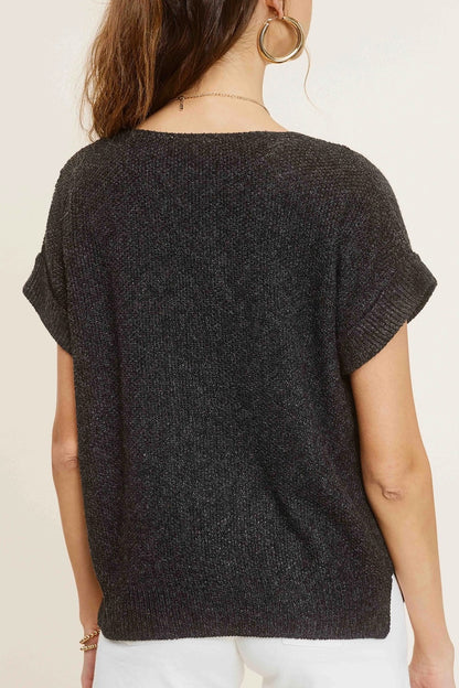 Woman wearing charcoal heather short-sleeve lightweight textured sweater with wide V-neck and side slits.