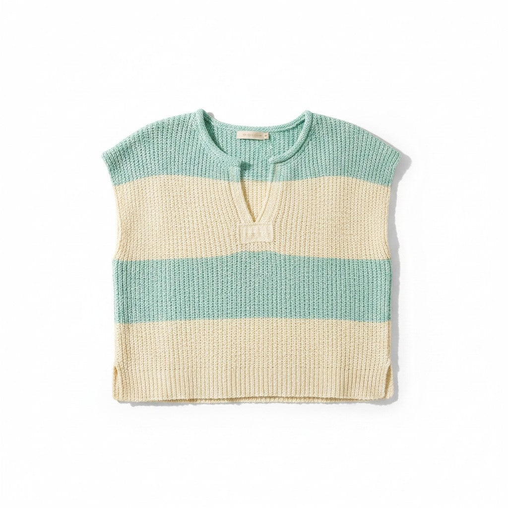 Knitted short sleeve top with two-tone design on a white background.