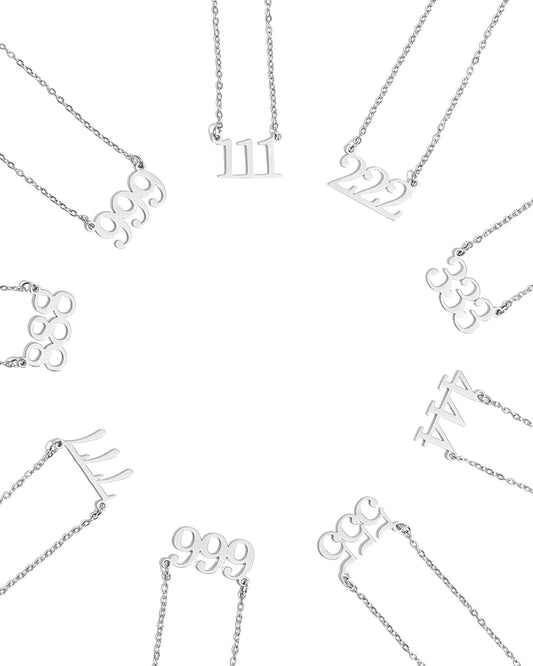 Collection of silver, waterproof necklaces with various Angel Number Pendants on a white background. 