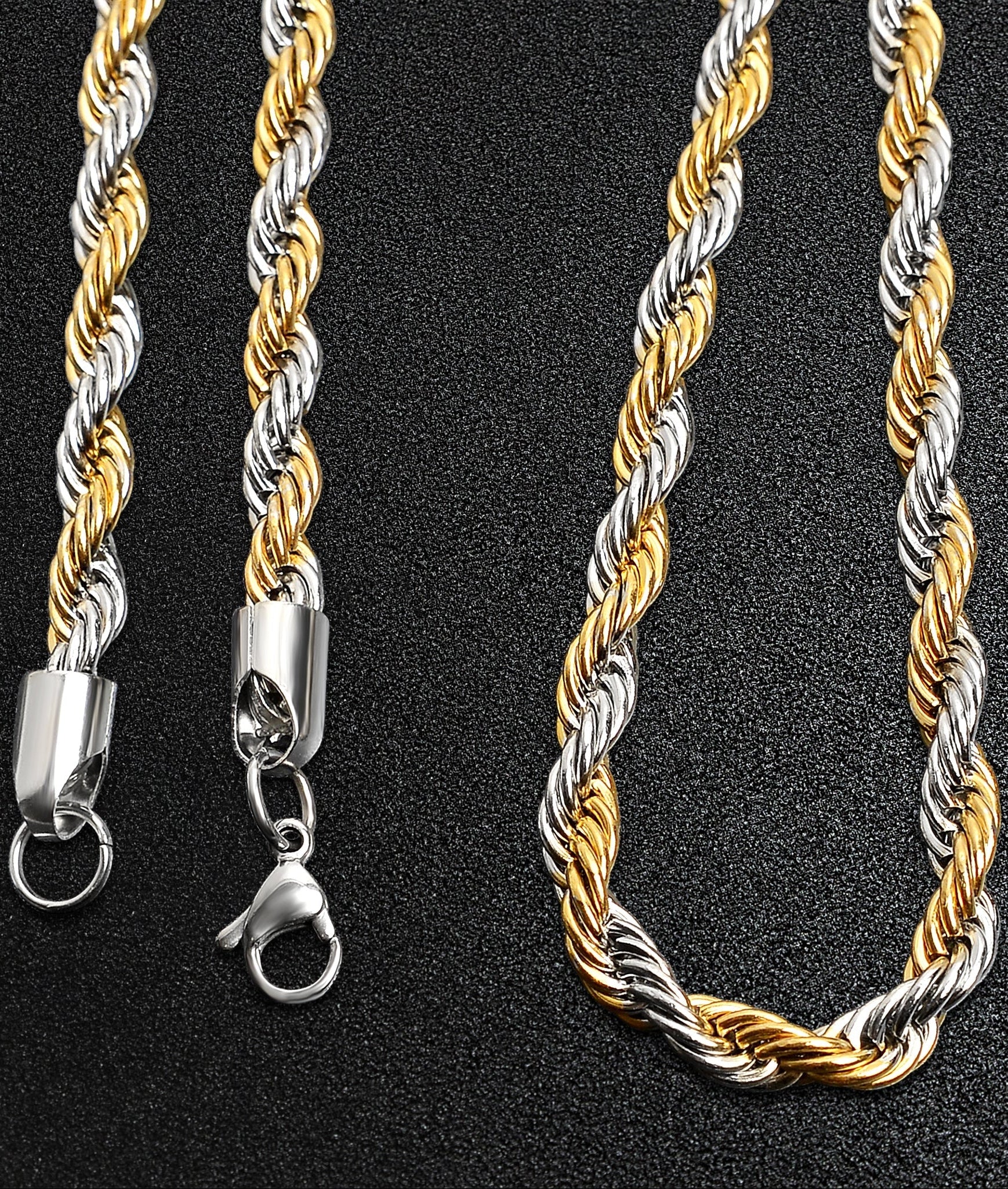 Two-tone gold and silver rope chain necklace on a black background