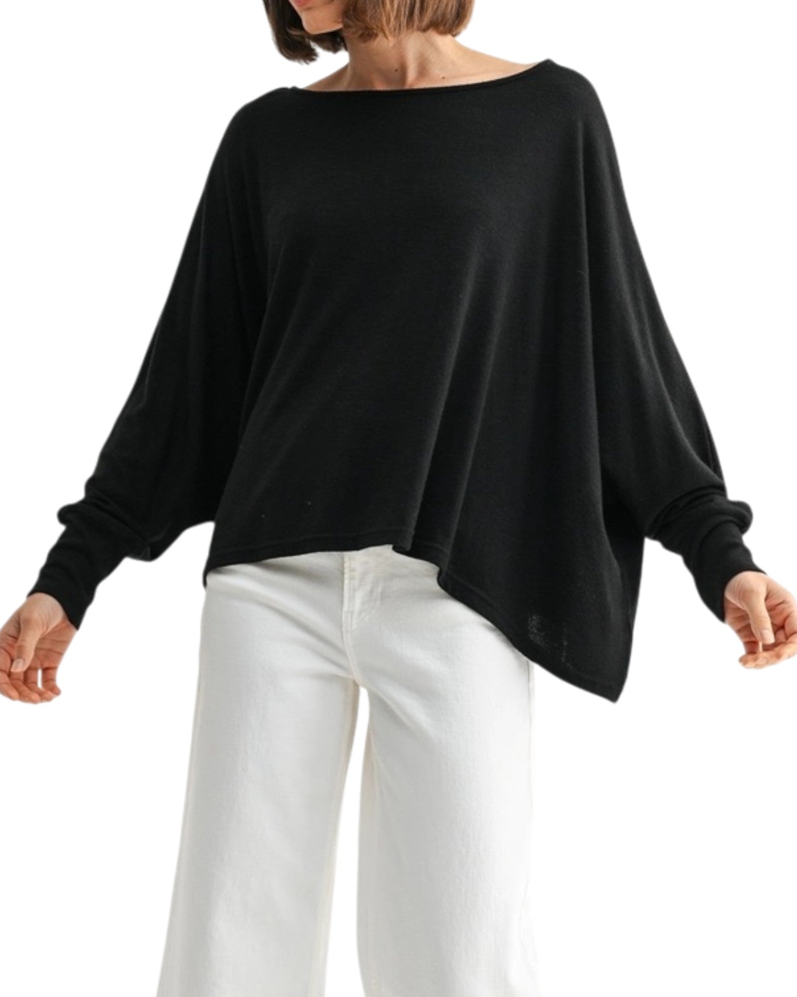Black oversized and lightweight long sleeve top worn by a person on a white background.