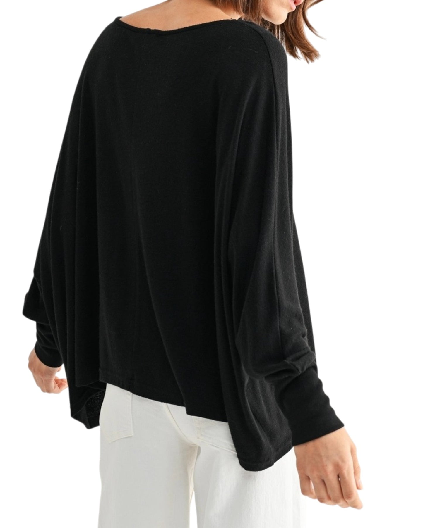 Black oversized and lightweight long sleeve top worn by a person on a white background.