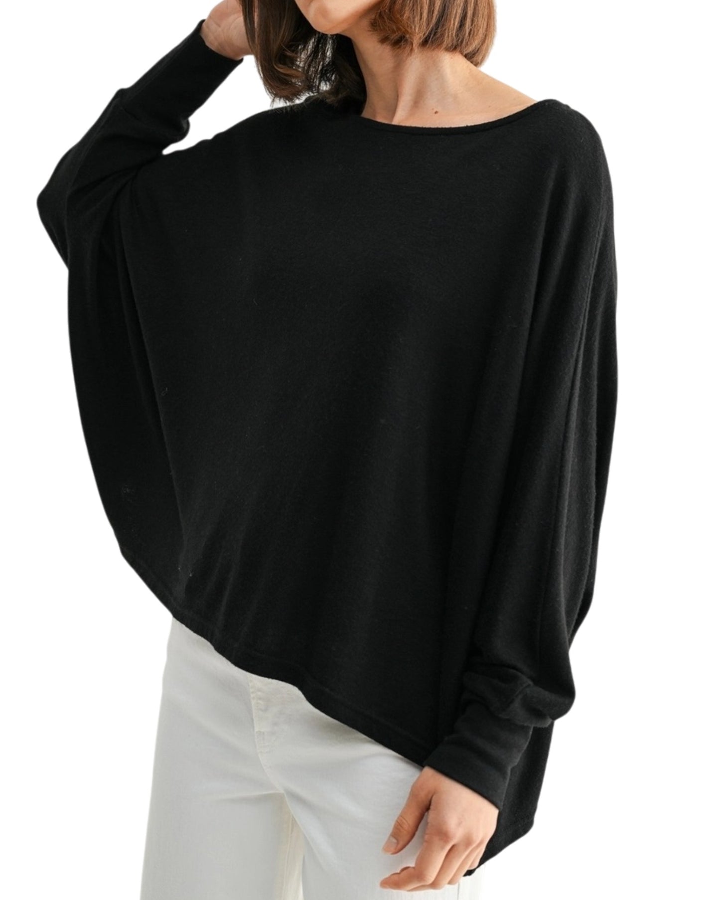 Black oversized and lightweight long sleeve top worn by a person on a white background.