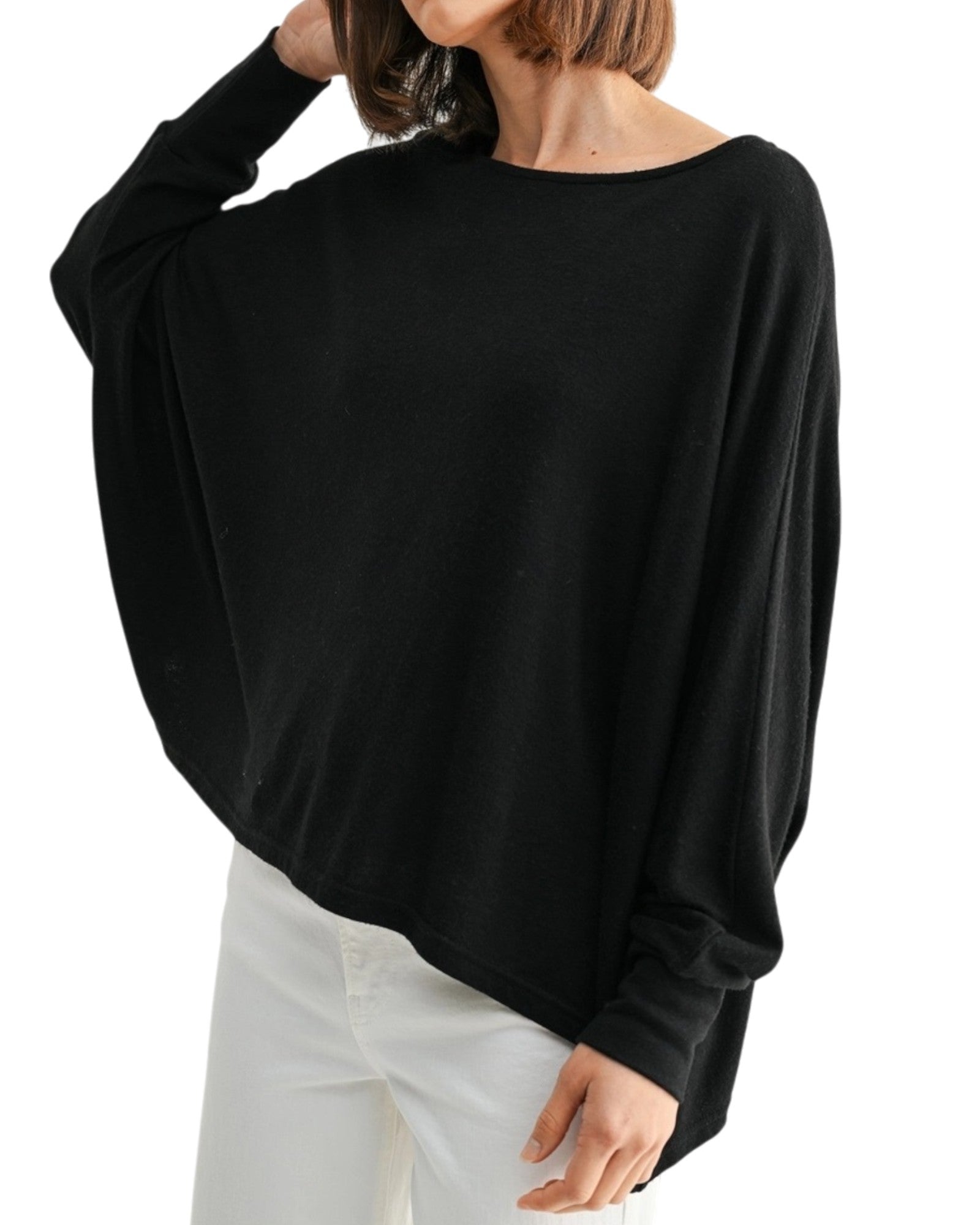 Black oversized and lightweight long sleeve top worn by a person on a white background.