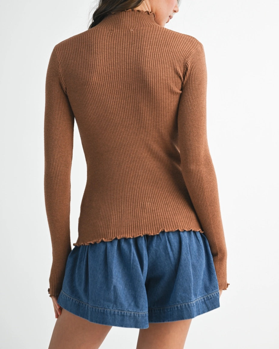  Caramel mock neck rib knit top with lettuce trim and long sleeves.