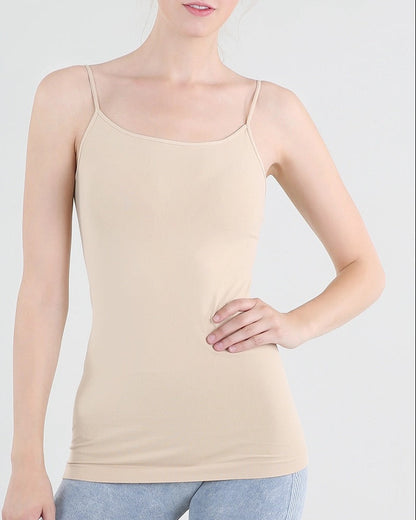 Woman wearing a beige/stone camisole against a white background.