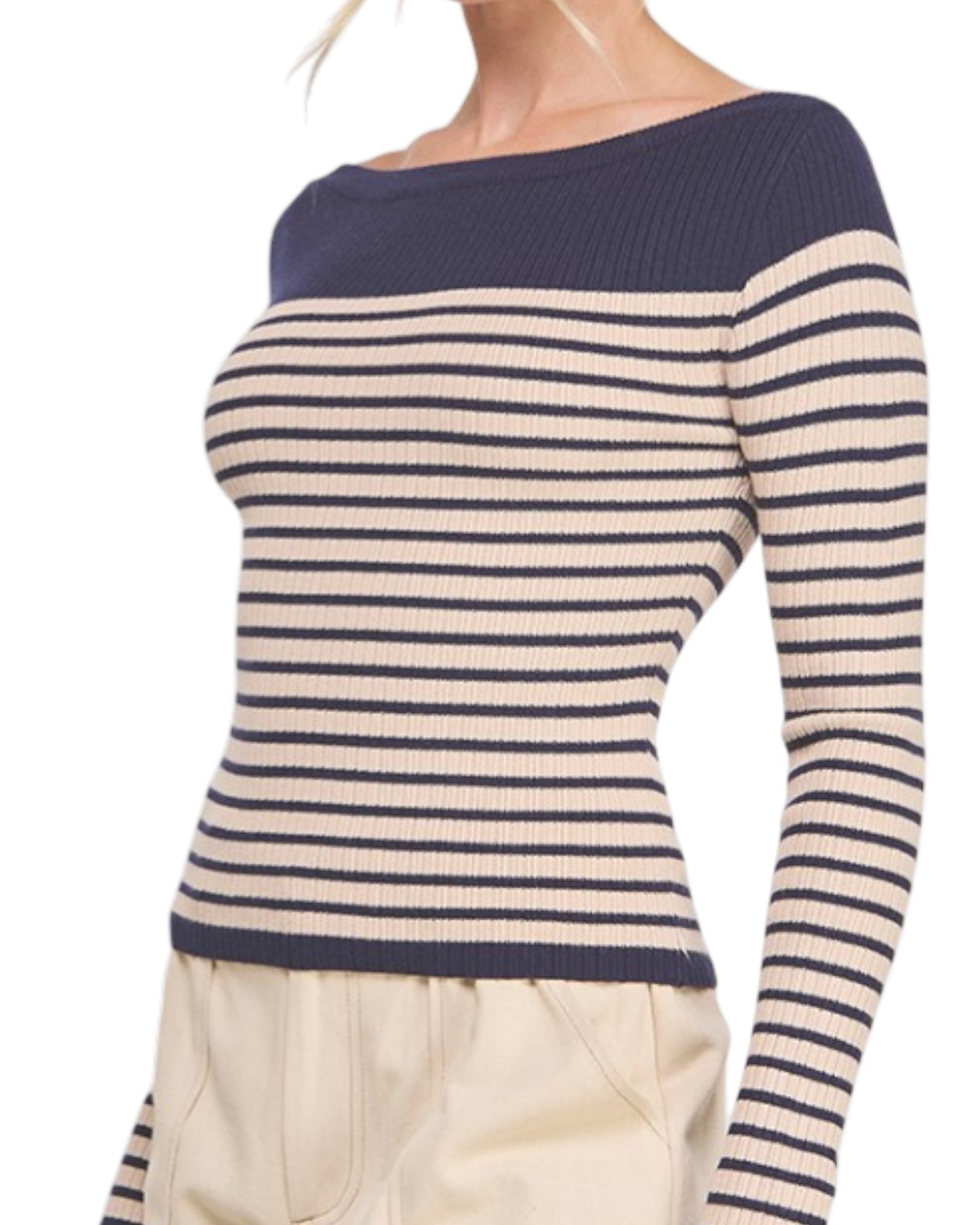 Navy and beige striped sweater worn by a person on a white background.