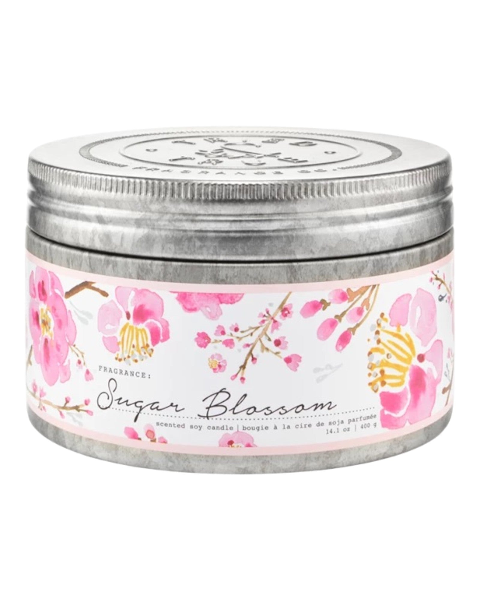 Candle jar with floral label on a white background.