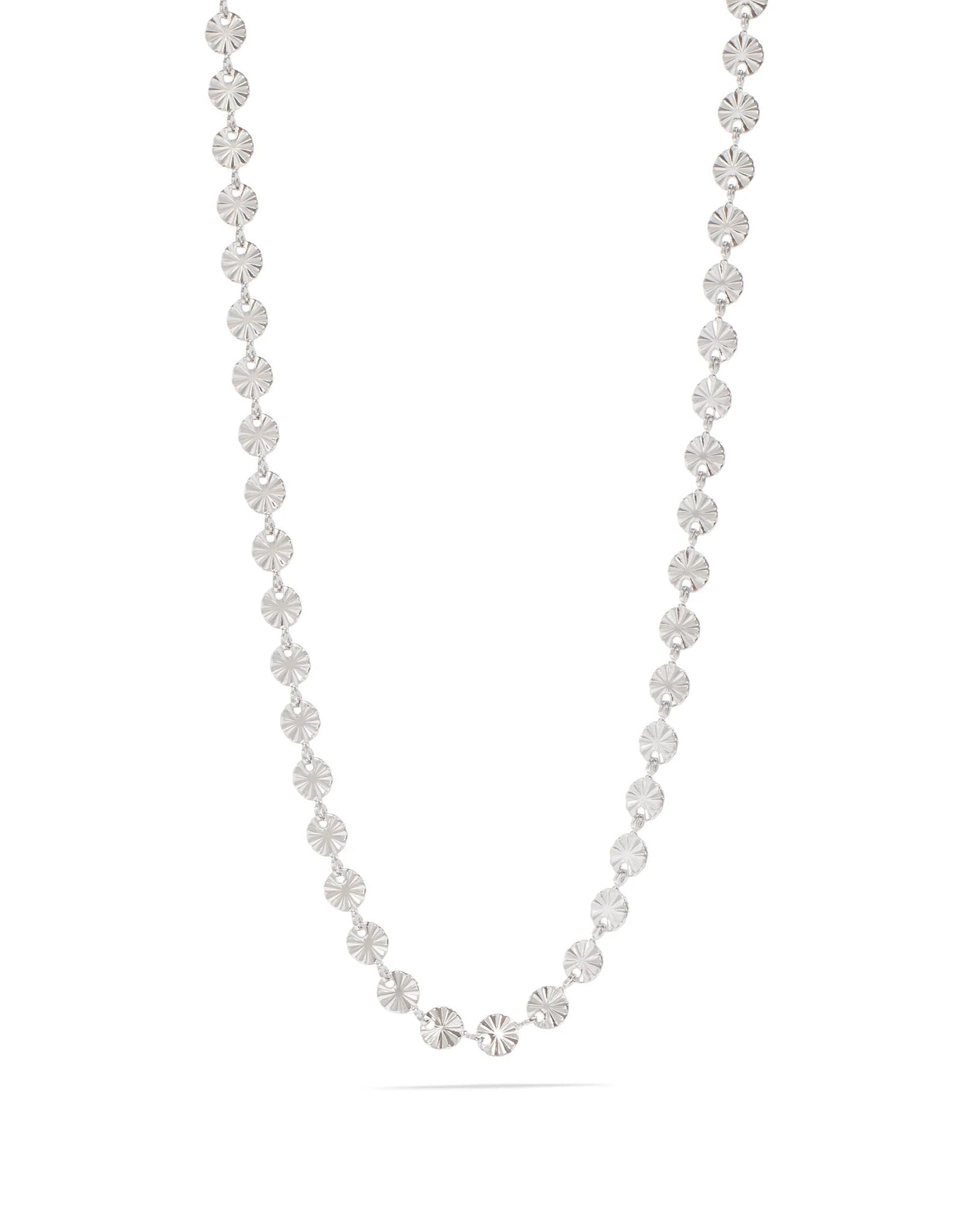 Silver sunburst necklace on a white background.
