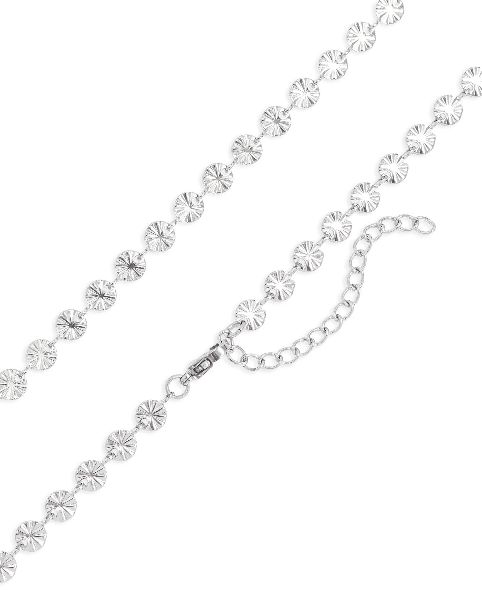Silver starburst necklace on a white background.