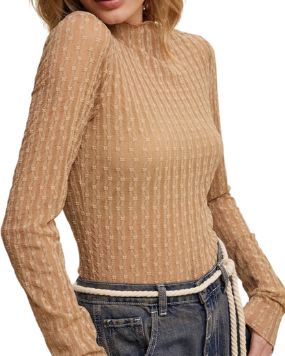 Tan semi-sheer textured long-sleeve top worn by a person on a white background.