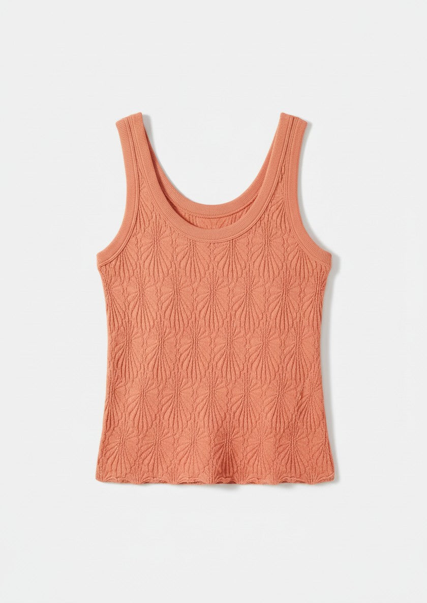 Peach-colored tank top on a white background.
