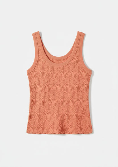 Peach-colored tank top on a white background.