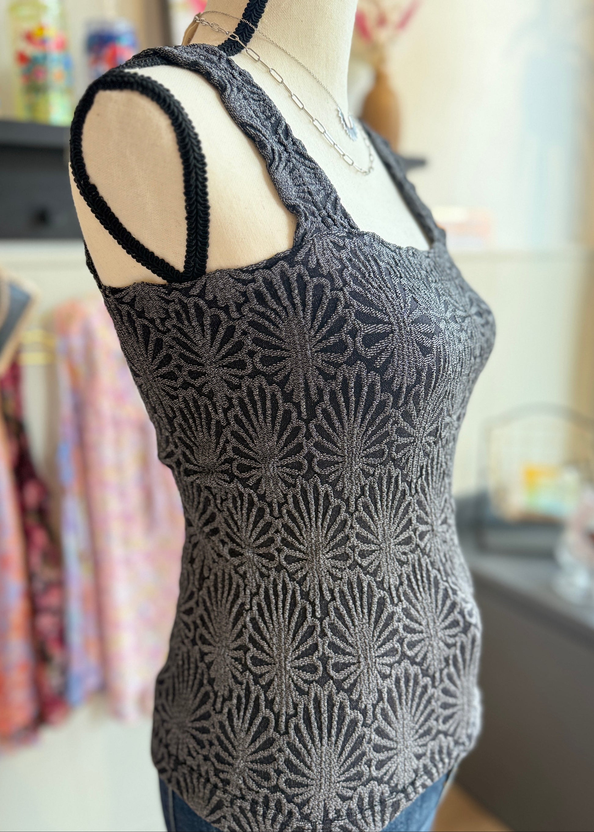 Charcoal fitted tank top with floral texture, square neckline and stretchy knit.