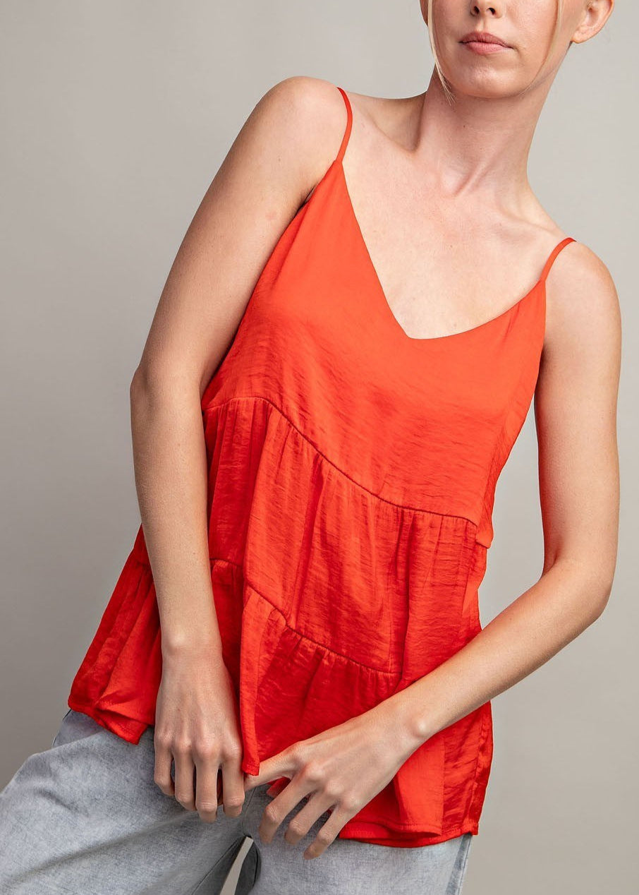 Sleeveless tiered v-neck tank top in Flame Red with silky fabric and relaxed fit