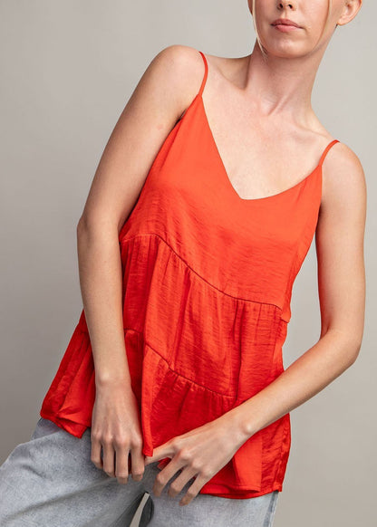 Sleeveless tiered v-neck tank top in Flame Red with silky fabric and relaxed fit
