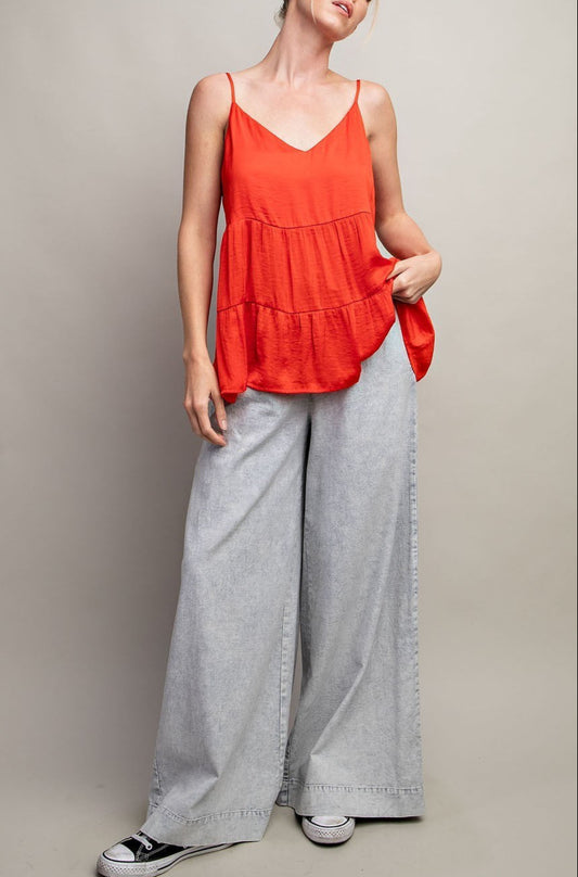 Sleeveless tiered v-neck tank top in Flame Red with silky fabric and relaxed fit
