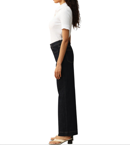 Person wearing dark blue wide-leg trouser-style jeans on a white background.