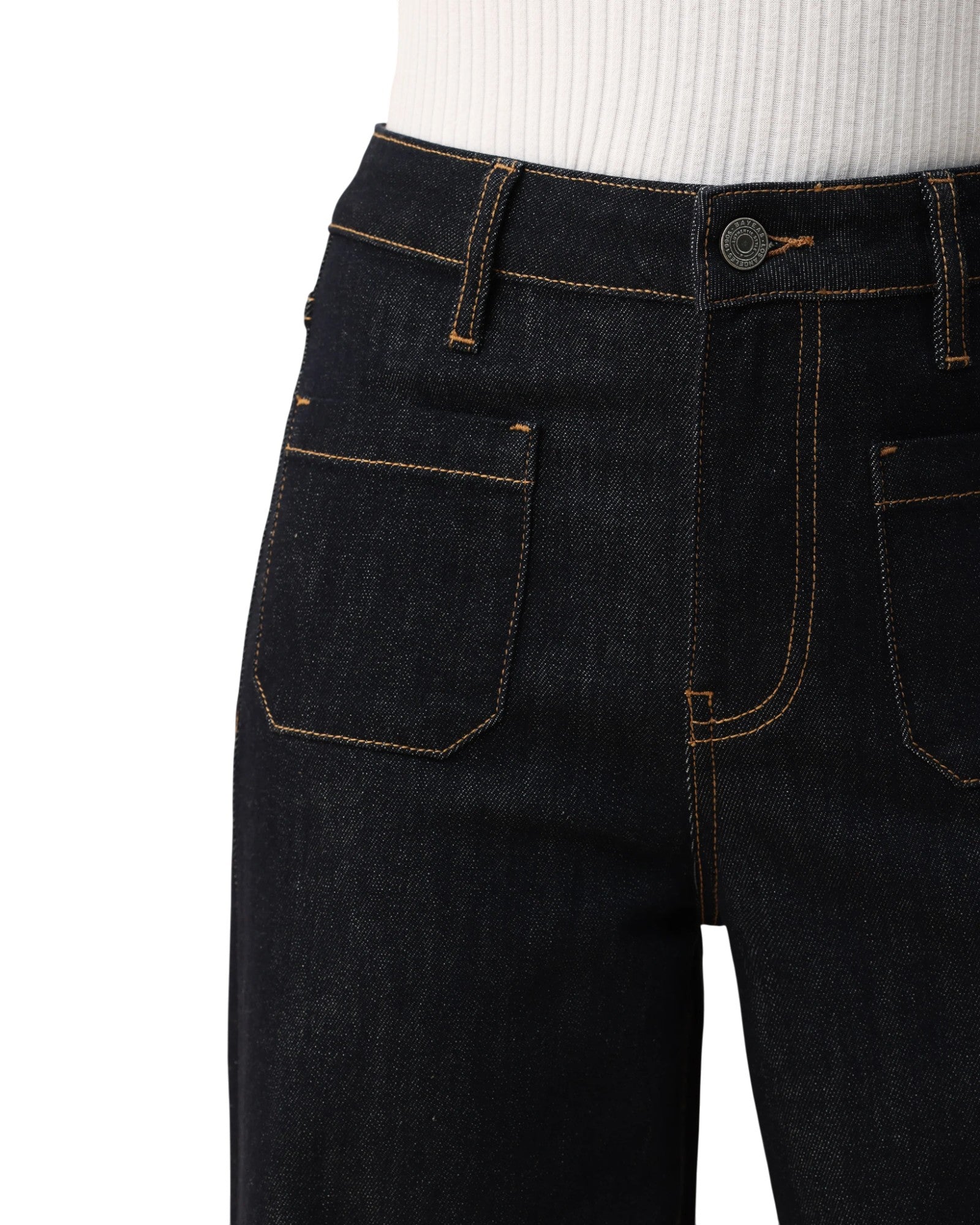 Person wearing dark blue wide-leg trouser-style jeans on a white background.