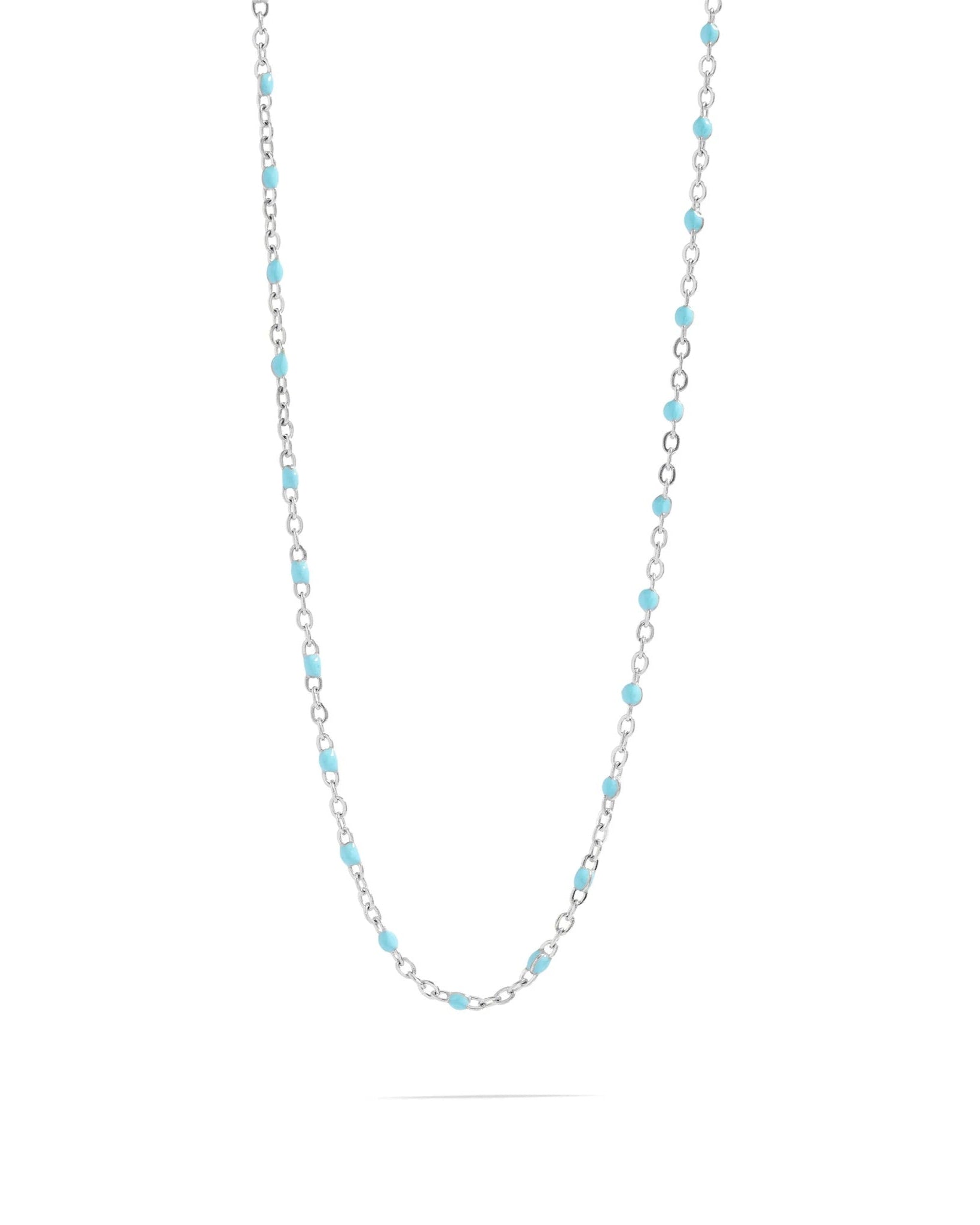 Silver necklace turquoise beads on a white background.