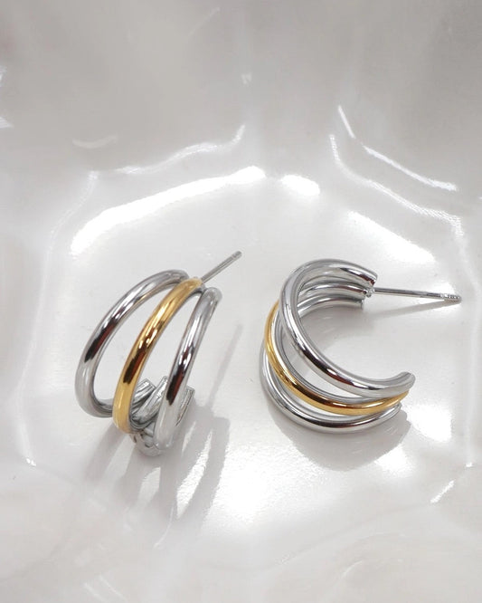 Silver and gold dainty triple layer hoop earring.
