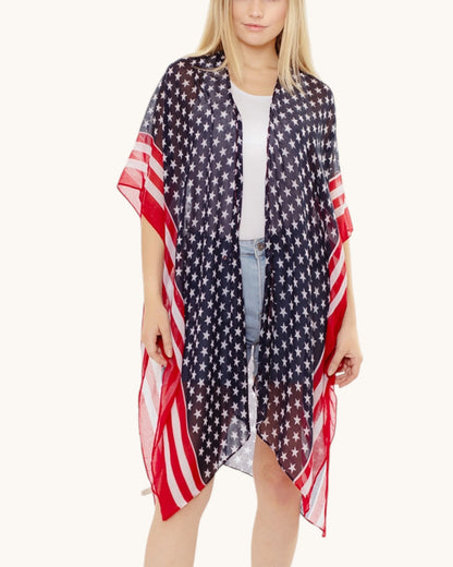 Woman wearing a American flag patterned kimono / cover up on a white background.