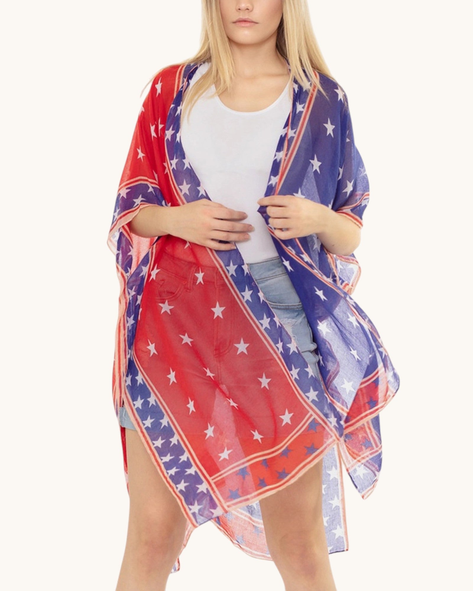 Woman wearing a red, white, and blue star-patterned kimono over a white shirt and jean shorts on a white background.