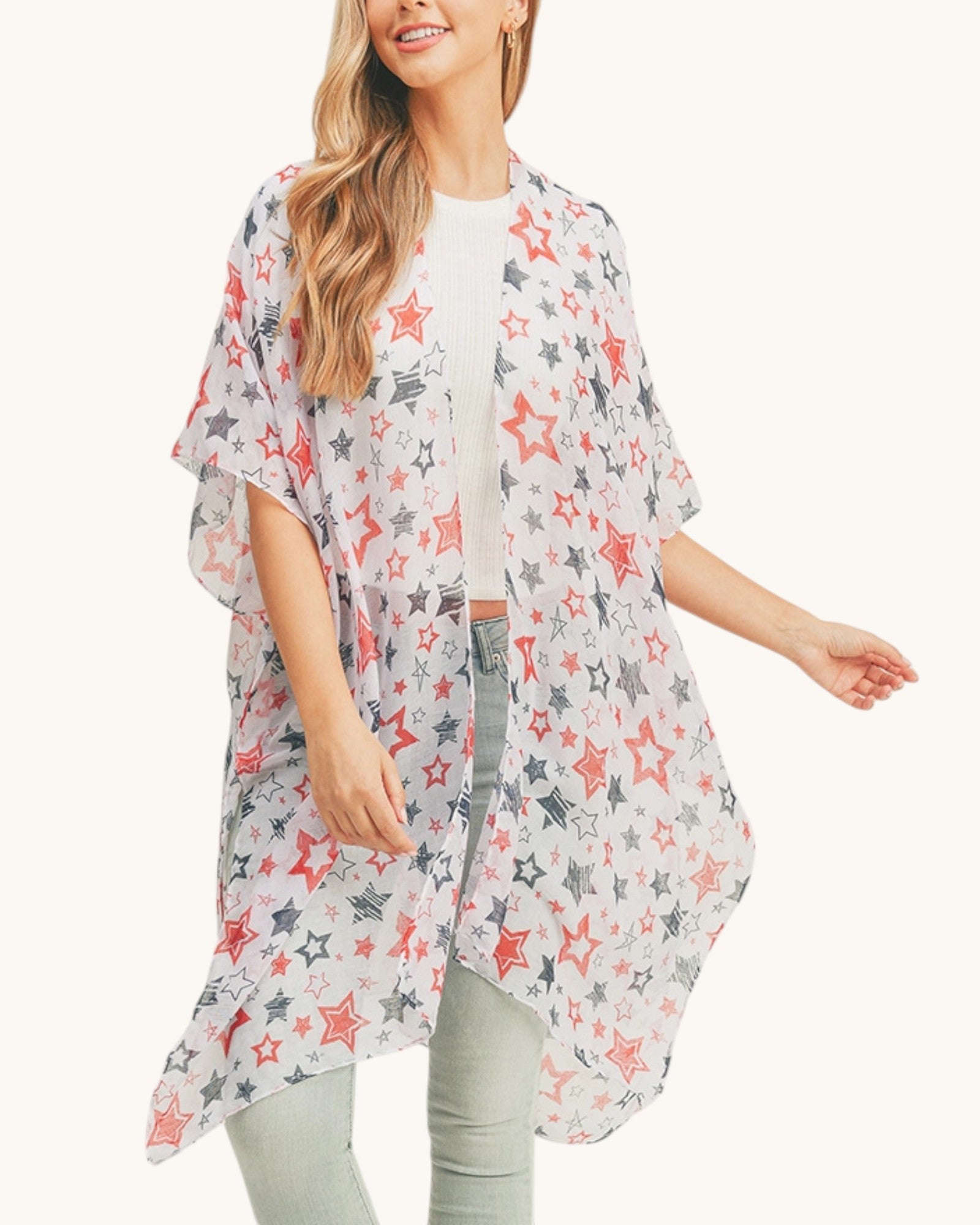 Woman wearing a star-patterned kimono-style garment on a white background.