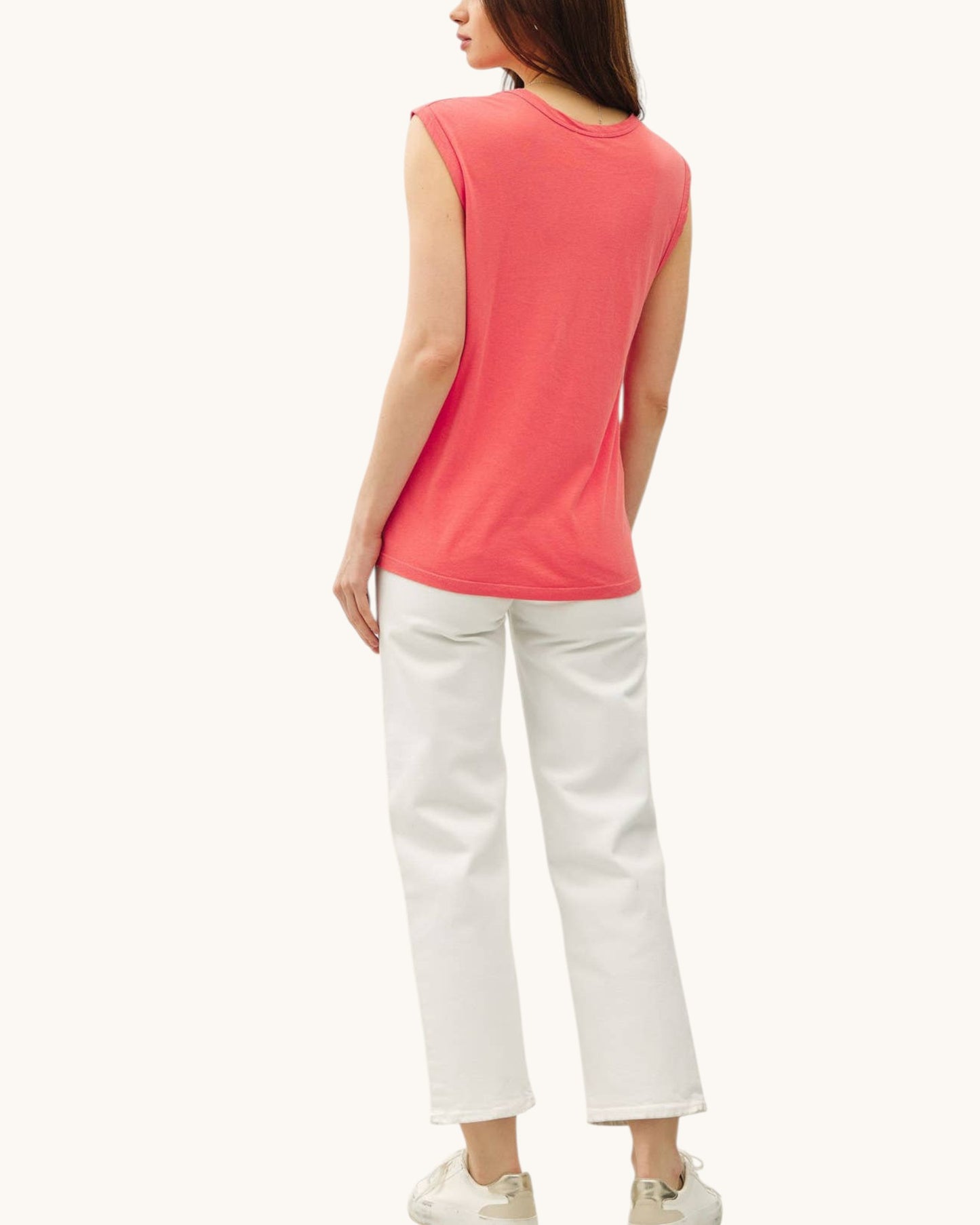 Back view of the Poppy Washed Scoop Neck Tank Top paired with cream denim pants and tennis shoes.