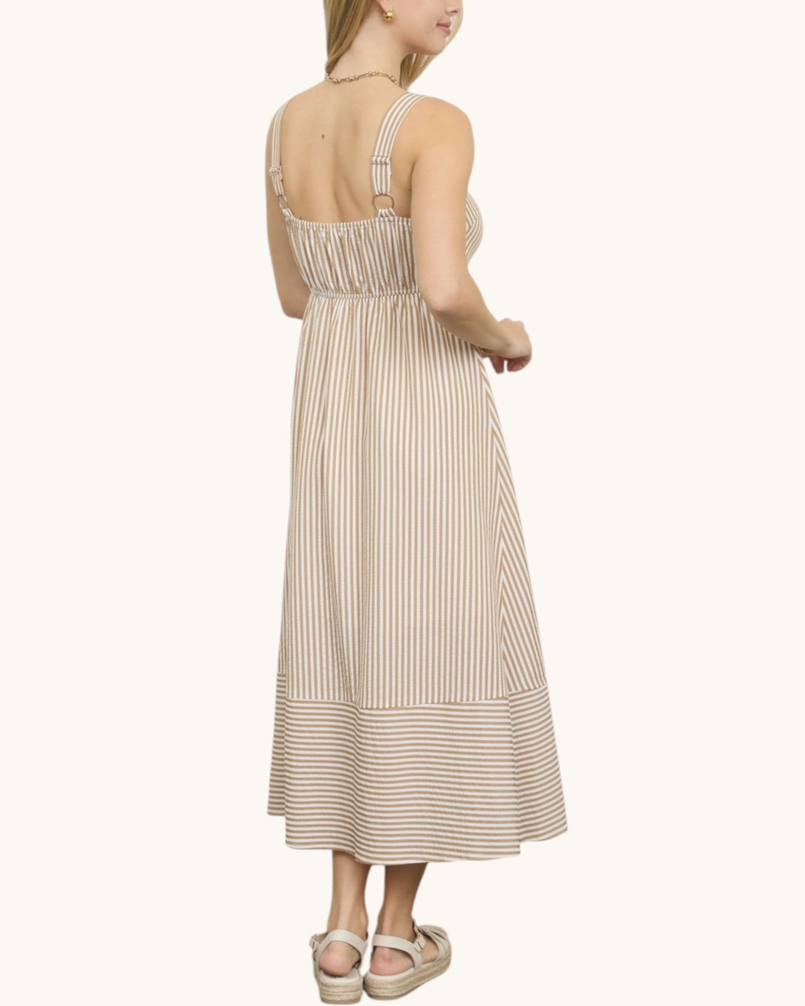 Back view of a beige and ivory striped summer sleeveless midi dress.