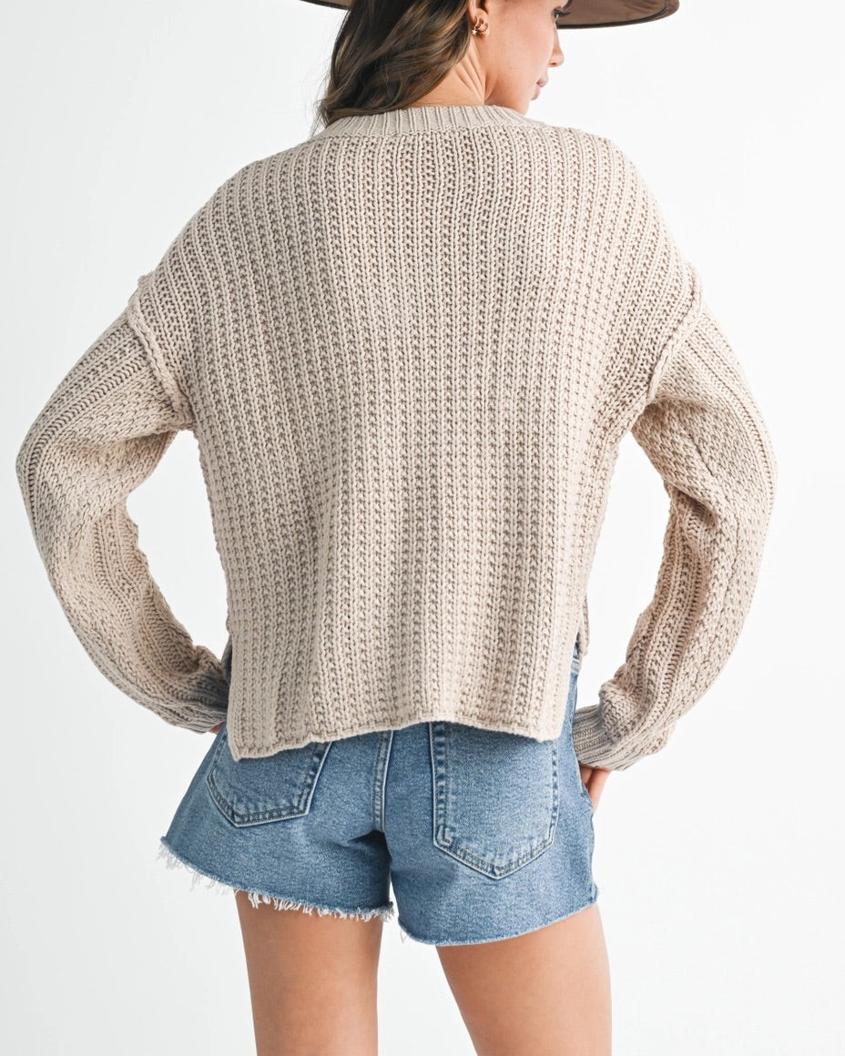 Wheat cable knit sweater with relaxed fit and chunky texture