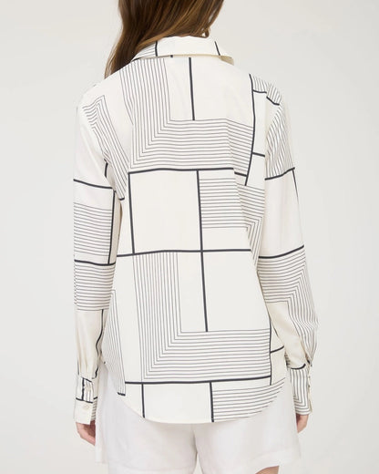 Black and white geometric print button down shirt with collared neckline. 
