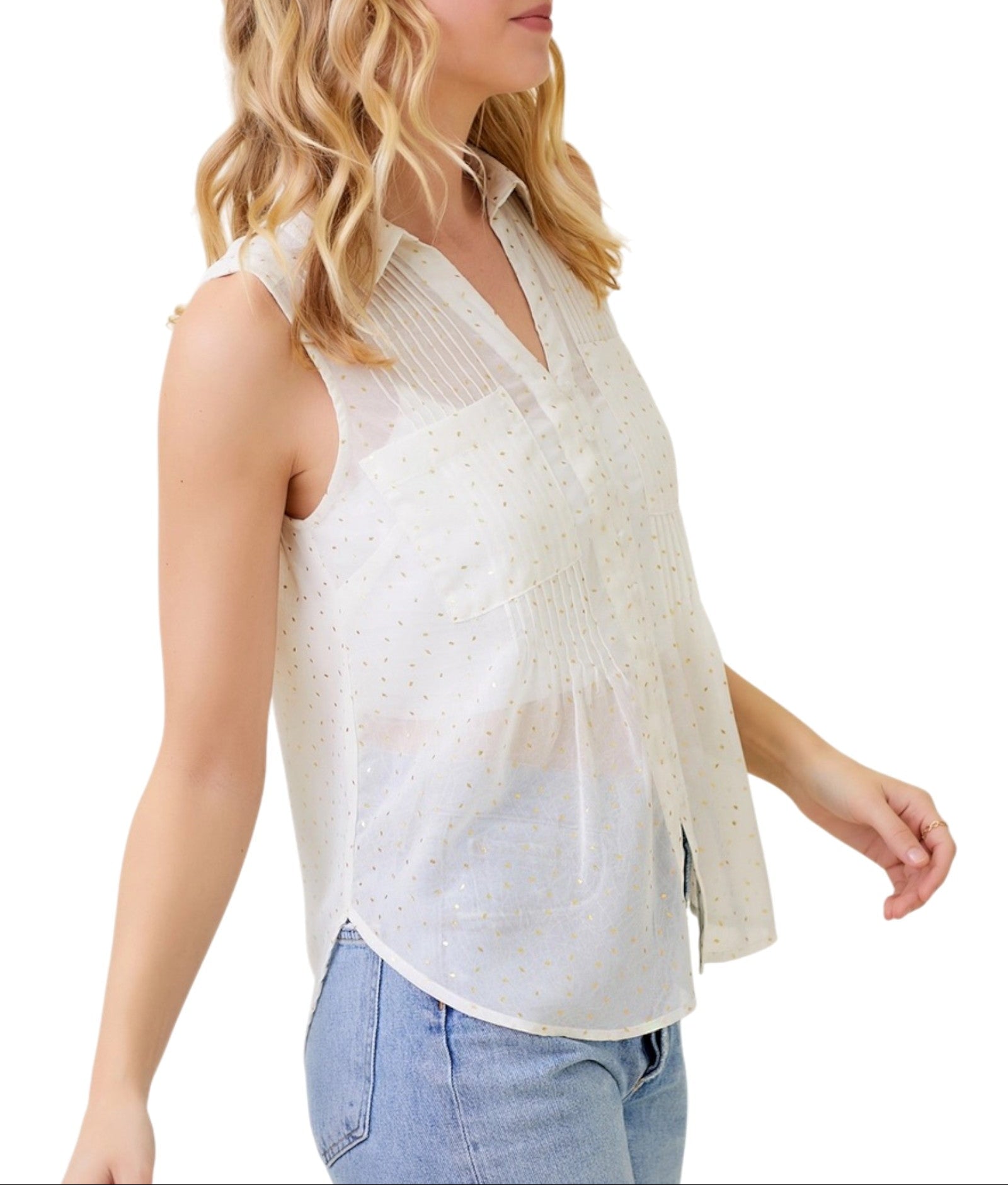 Woman wearing a white sleeveless top with a subtle gold flecks on a white background.