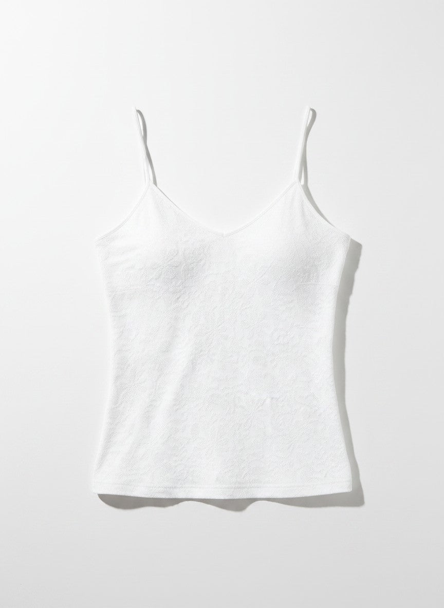 White floral tank top on a light background.