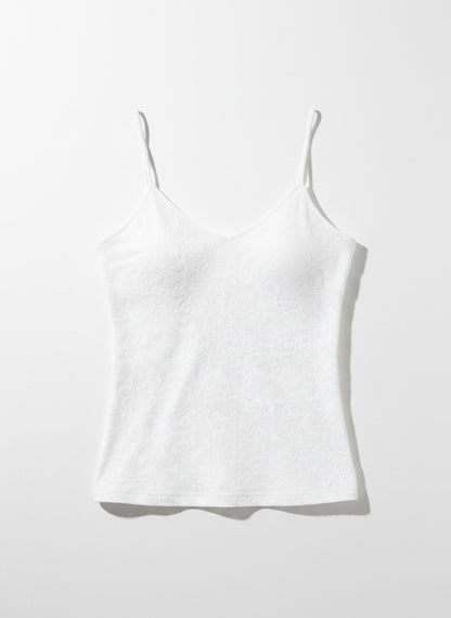 White floral tank top on a light background.
