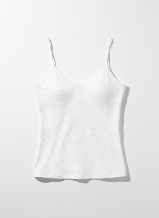 White floral tank top on a light background.