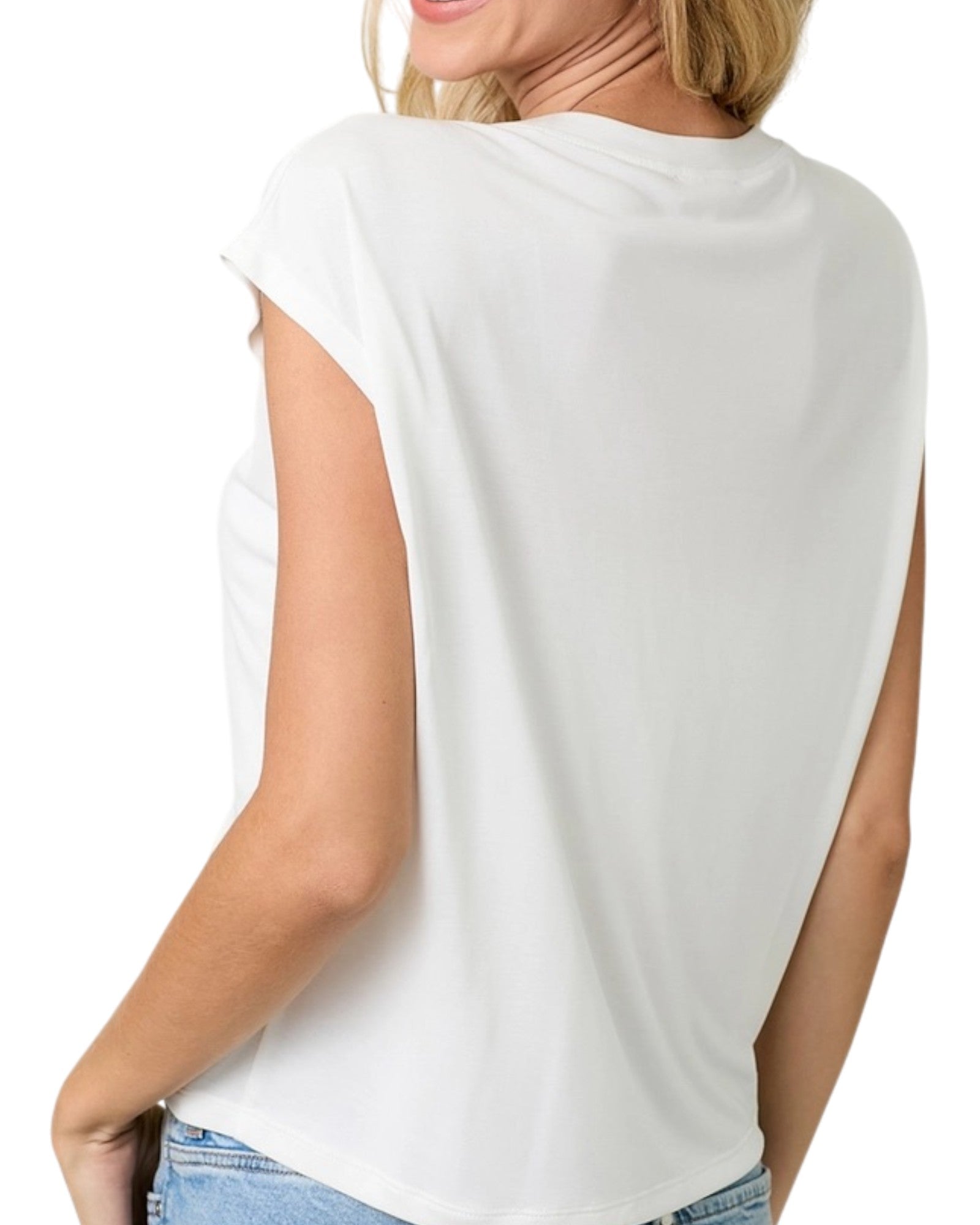 White sleeveless top worn by a person on a white background.