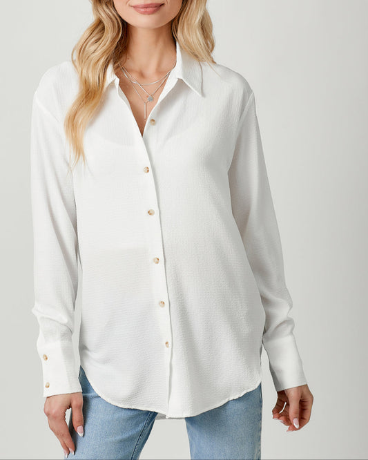 White textured lightweight button-down shirt with collared neckline.