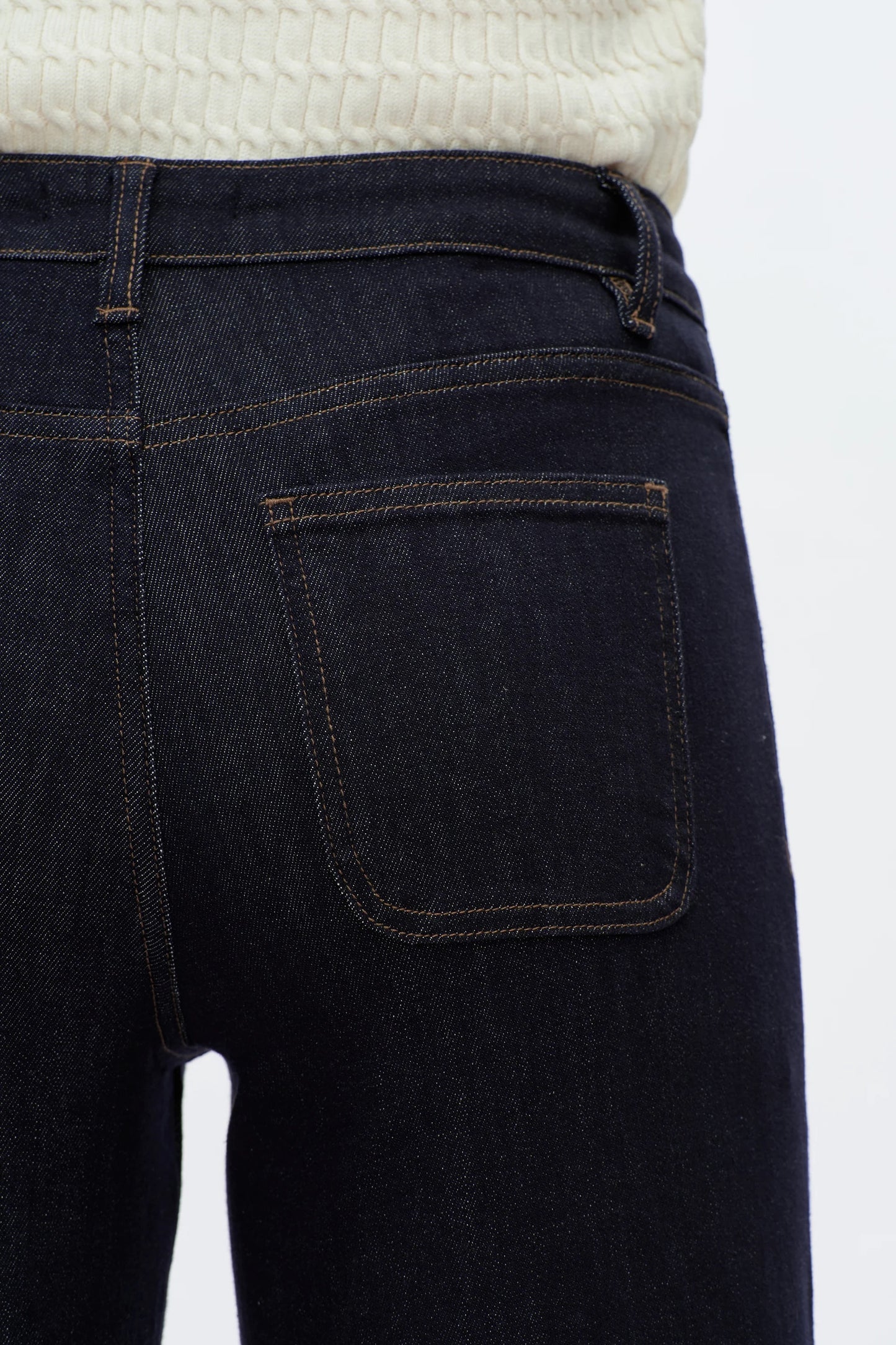 Dark blue jeans with a white background