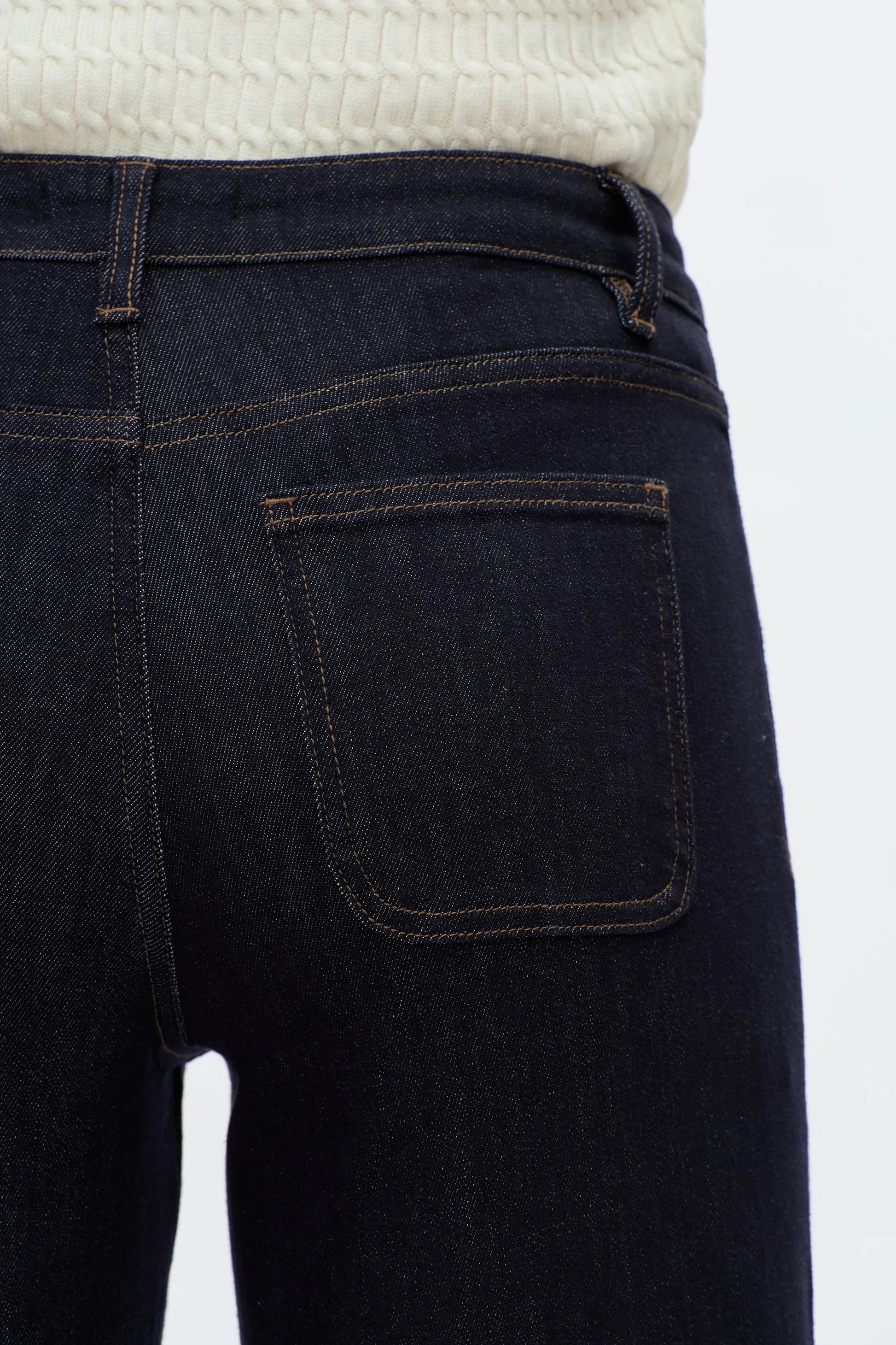 Dark blue jeans with a white background