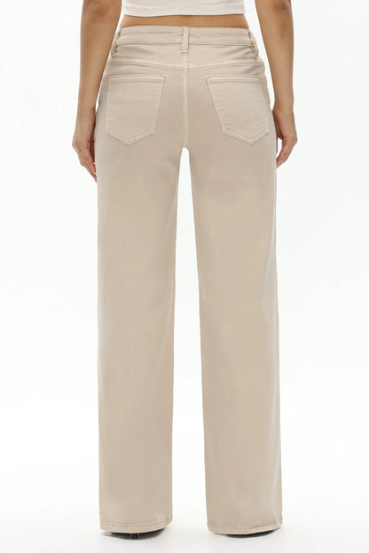 A person shown from the back wearing light beige wide-leg jeans with a straight-to-medium leg and two back pockets, photographed against a plain white studio background.