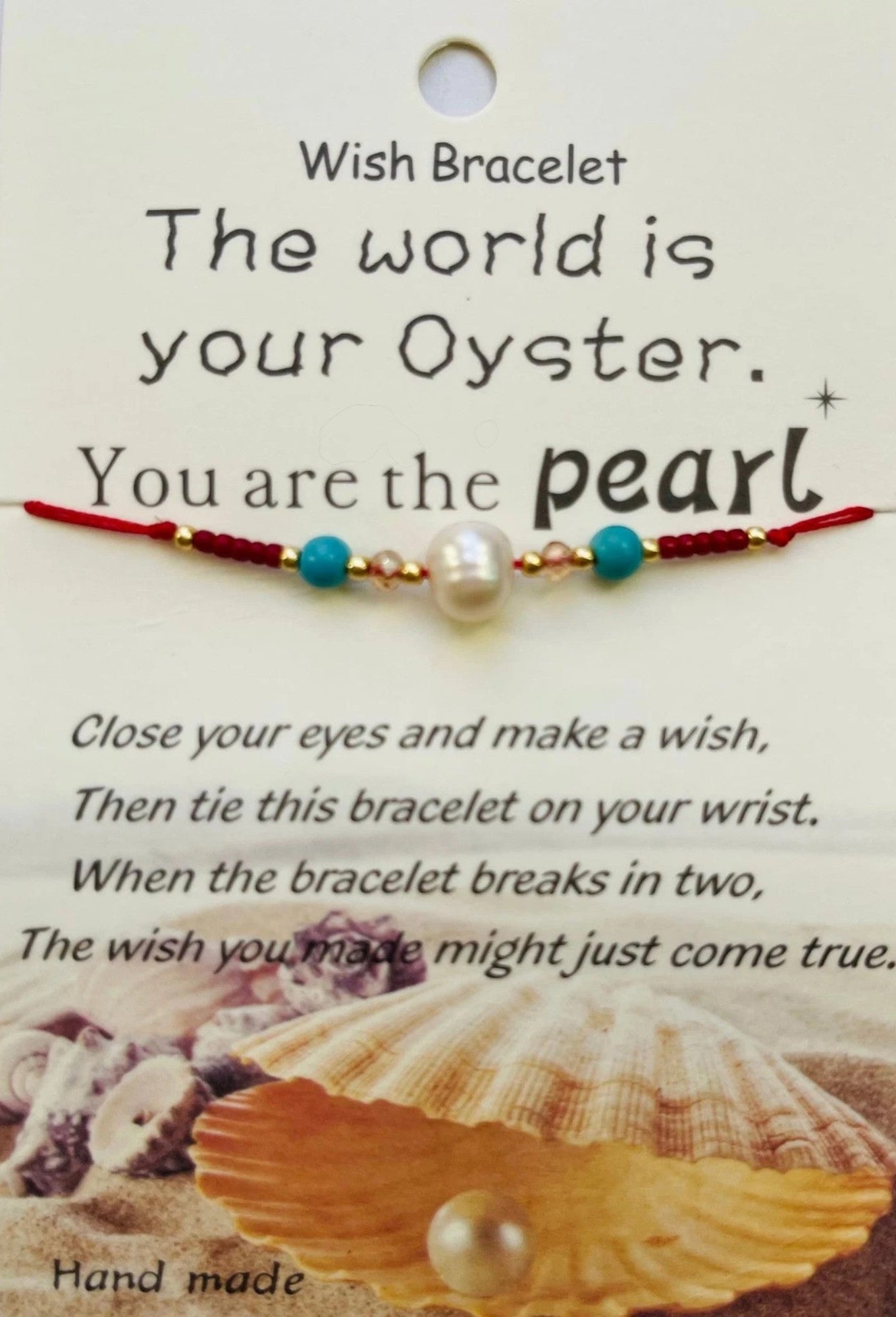 Wish bracelet with pearl and text on a card with shell and pearl illustration.