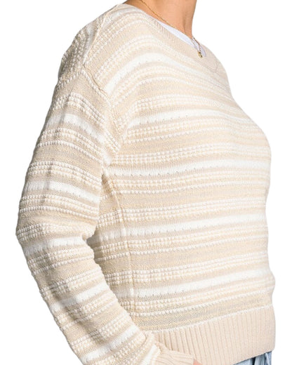 White and light beige textured knit sweater with boat neckline and relaxed fit.