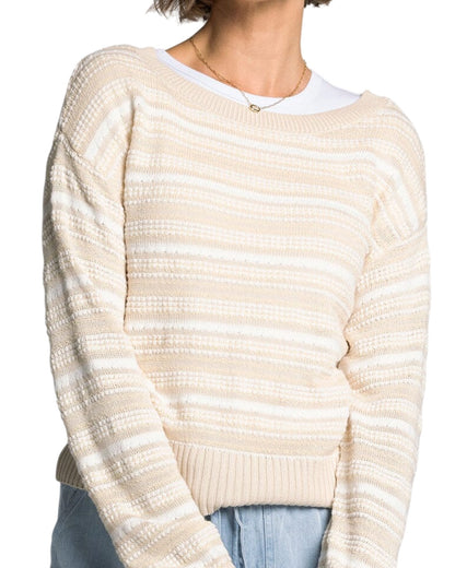 White and light beige textured knit sweater with boat neckline and relaxed fit.