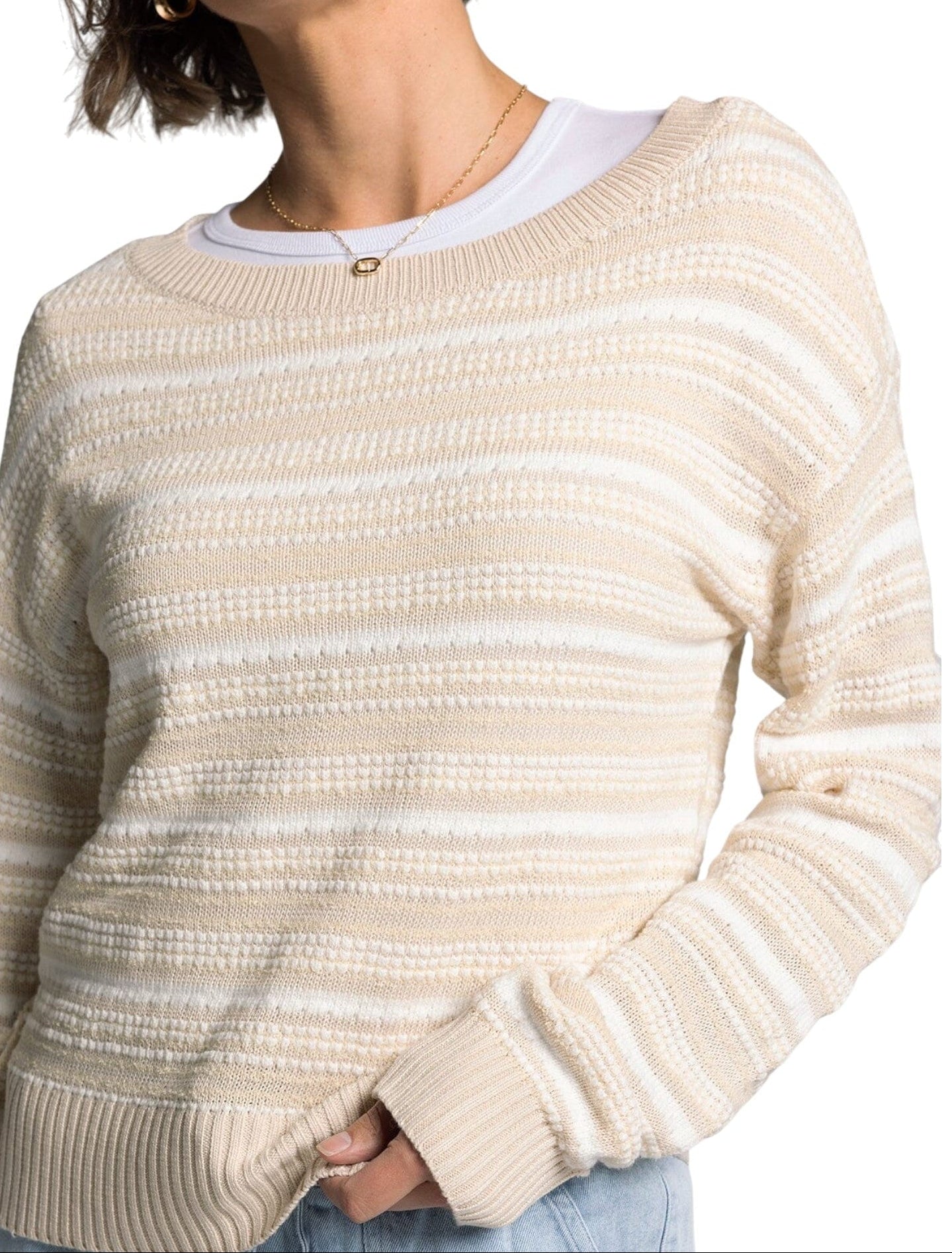 White and light beige textured knit sweater with boat neckline and relaxed fit.